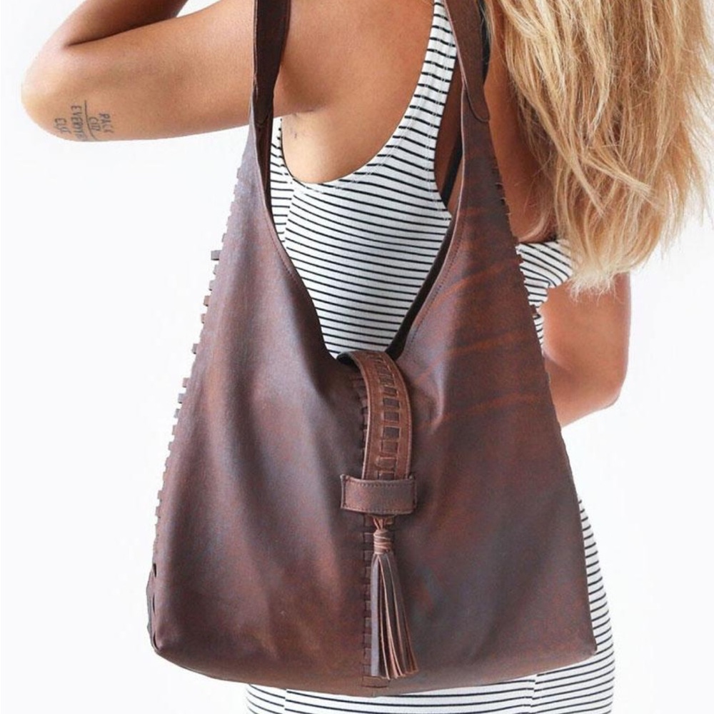 Spacious Brown Leather Shoulder Bag with Tassel Accent